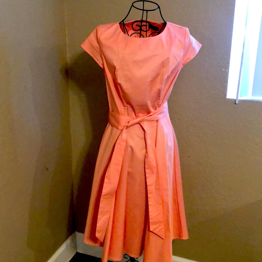 Peach colored casual dress.